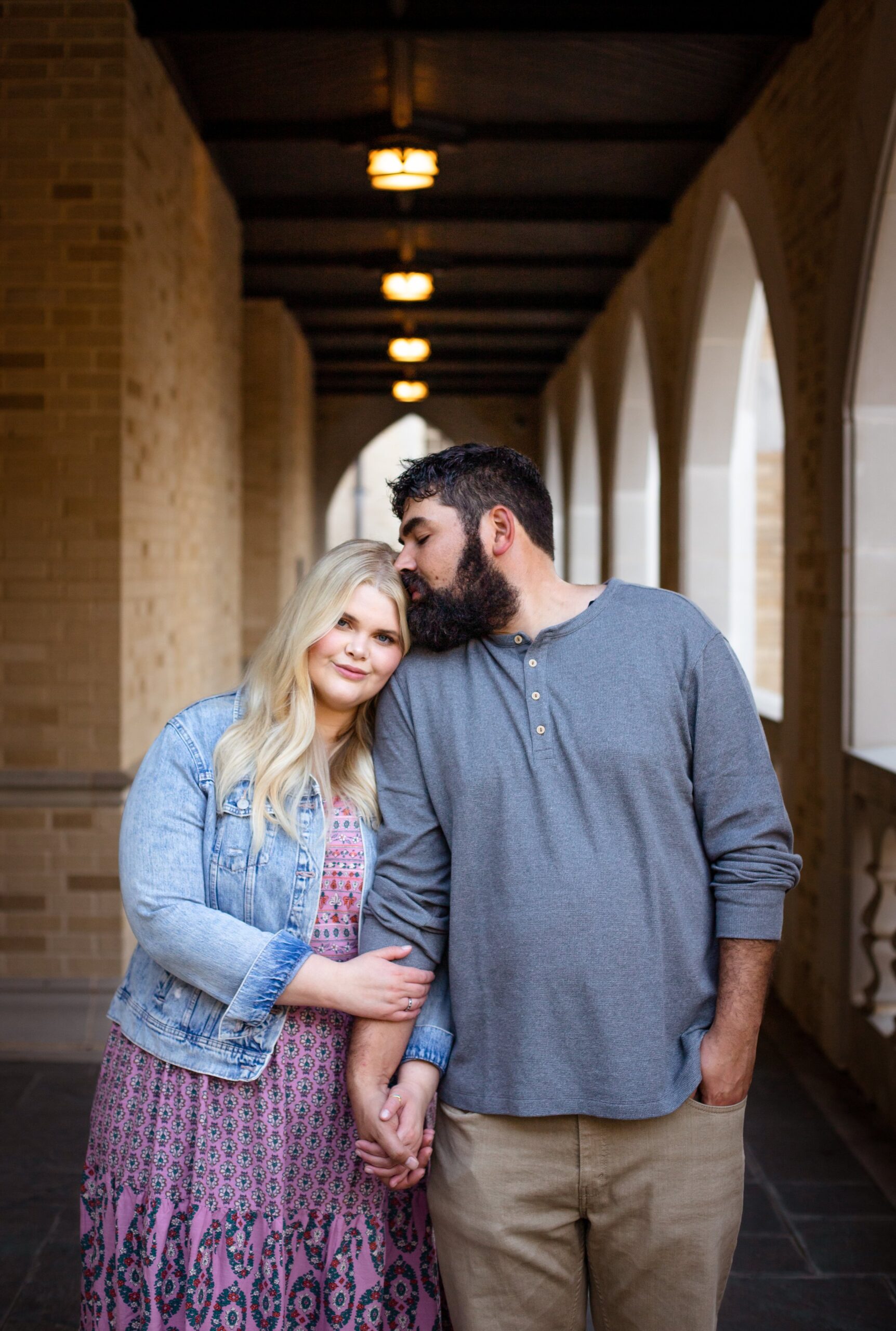 SMU engagement session photography in Dallas couple kissing forehead