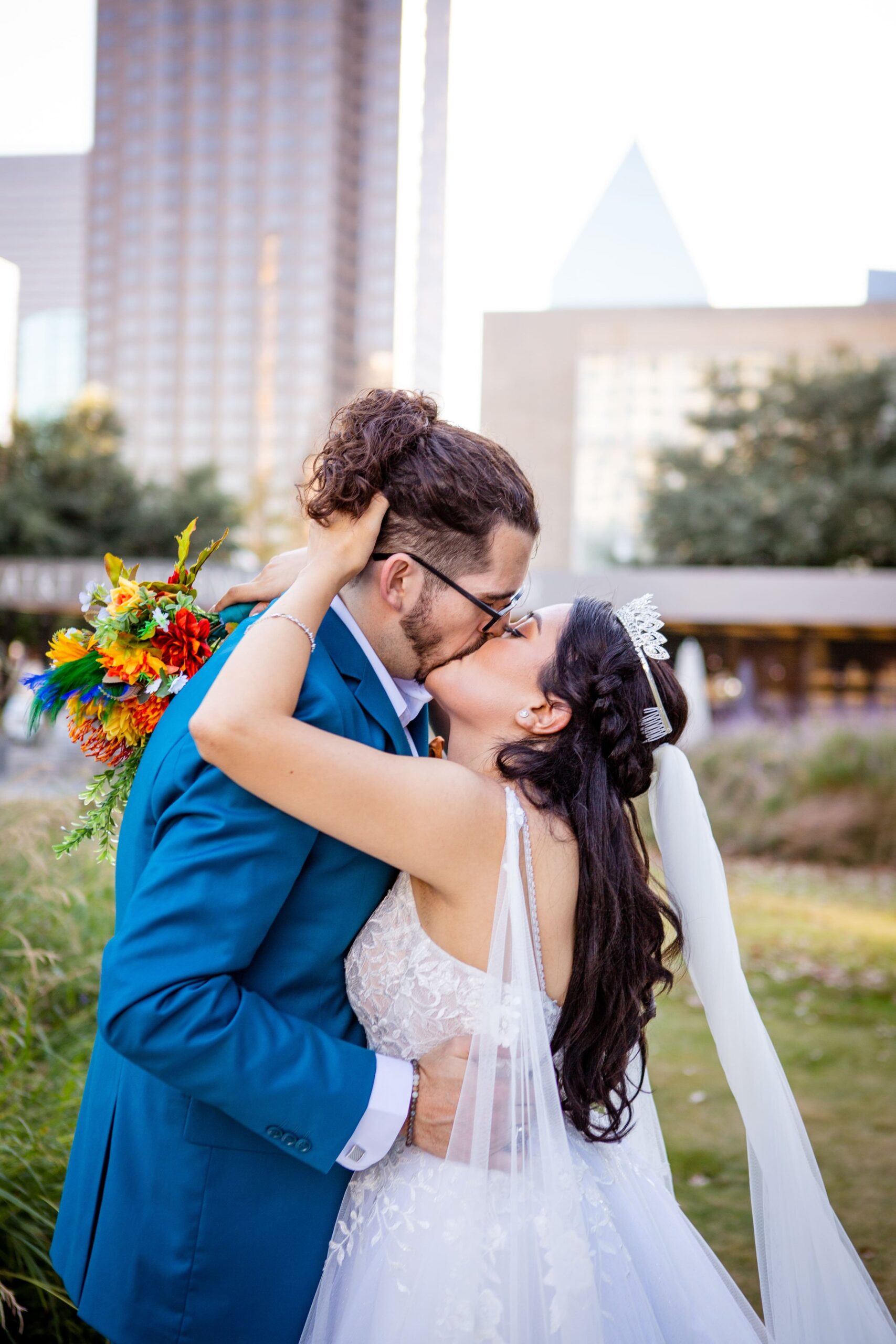 Married couple kissing in downtown Dallas wedding photos