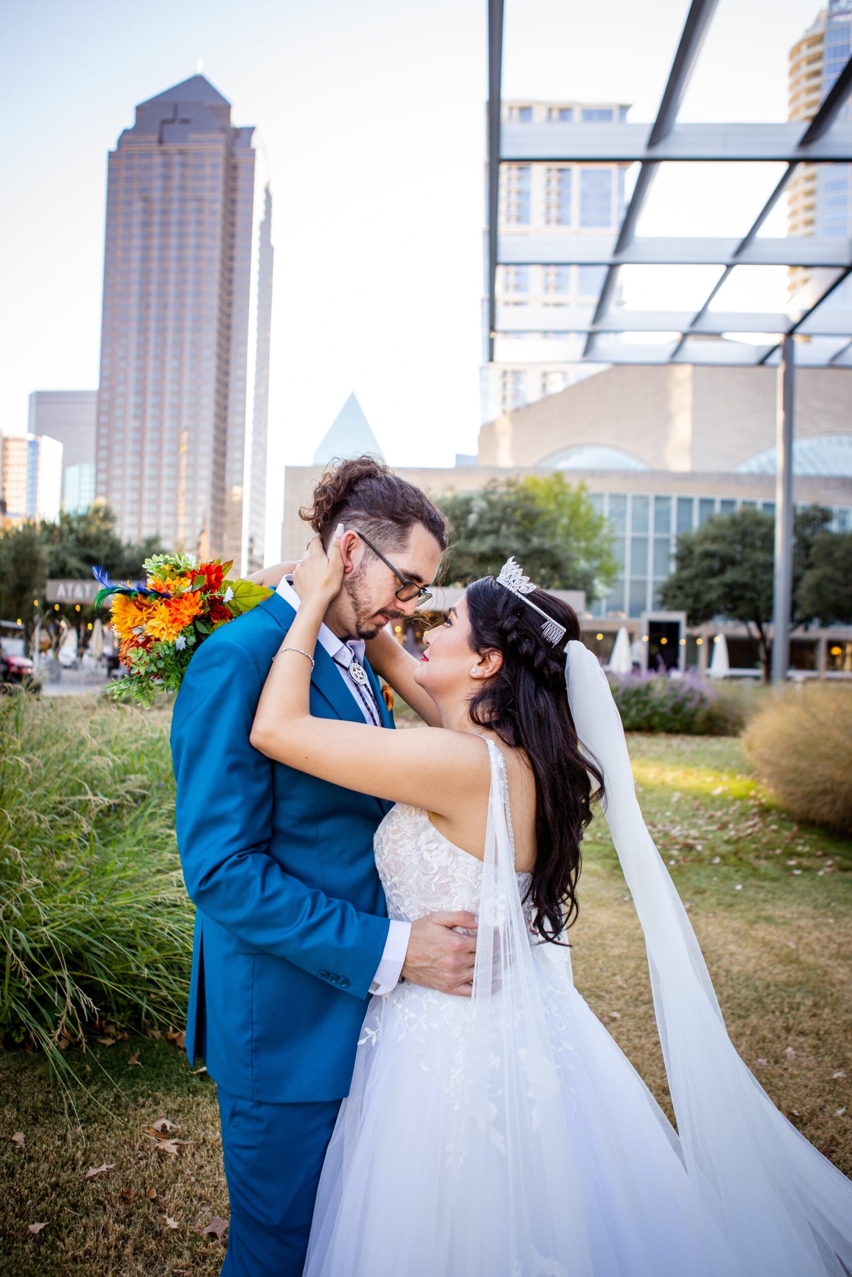 Romantic downtown Dallas wedding photo with skyline backdrop