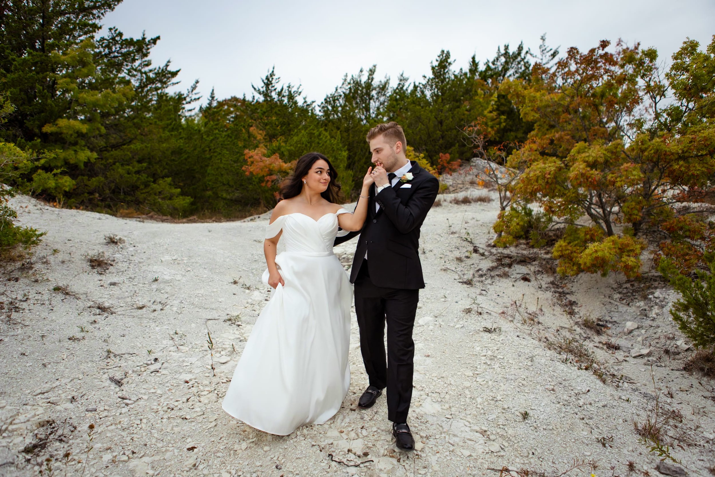 Mckinney Texas wedding bride and groom photo walking together kissing hand