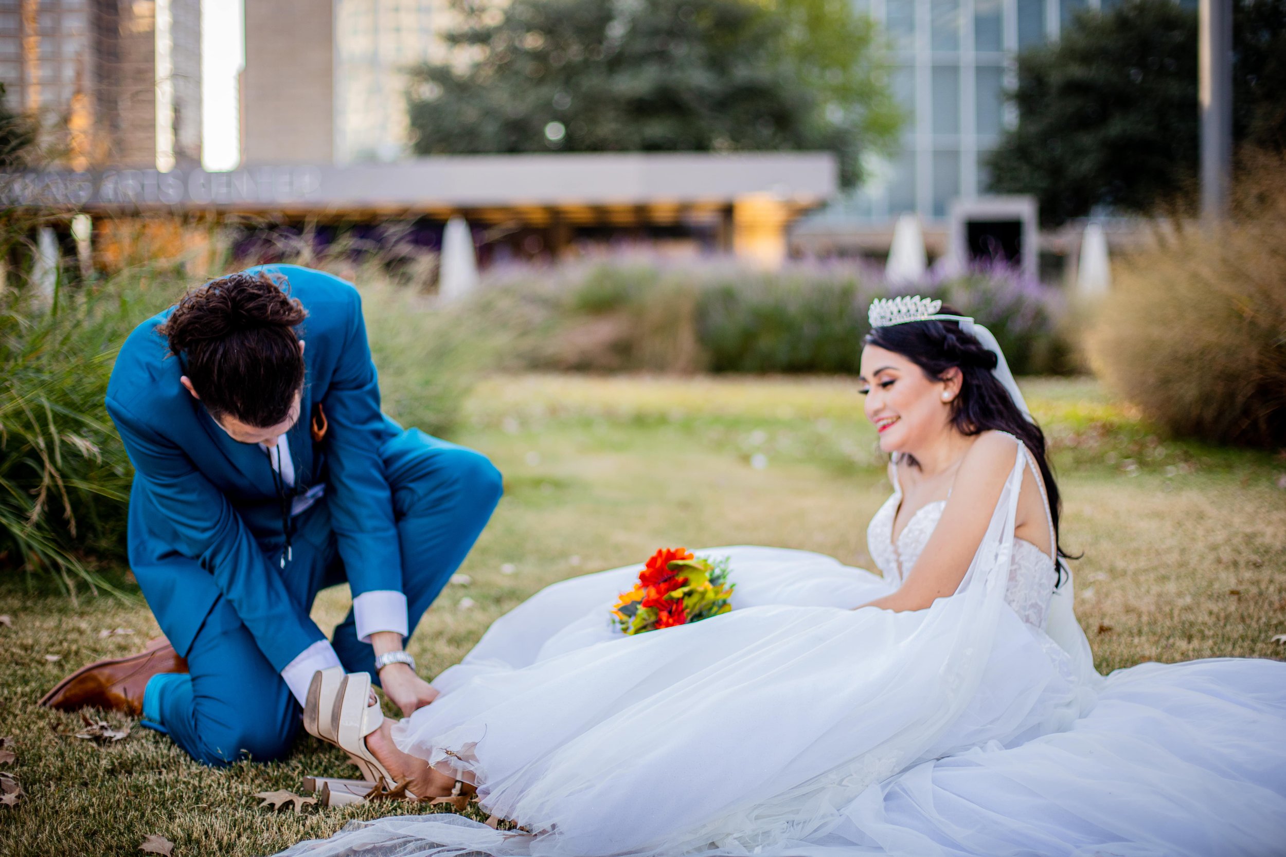 Bride and groom candid moment in Downtown Dallas cityscape